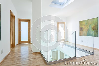 Stairs, glass banister and doors in modern hallway Stock Photo