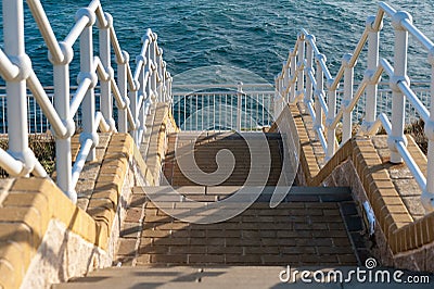 Stairs going down to the Mediterranean sea at southern part of Gibraltar Stock Photo