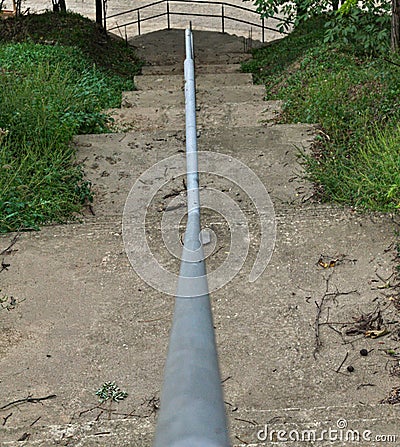 Stairs going down from top of the hill Stock Photo