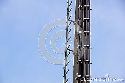 Stairs to the comunications pole with wires and cable Stock Photo