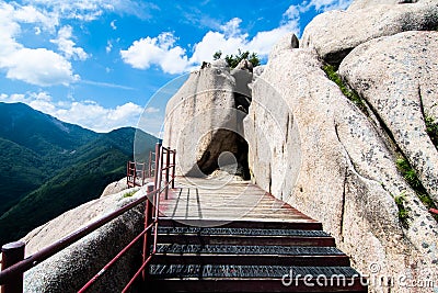 Stairway leading up to the peak of Ulsan Bawi Rock. Stock Photo