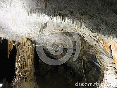 Stalactite and stalagmite of Postojna Cave. Stock Photo