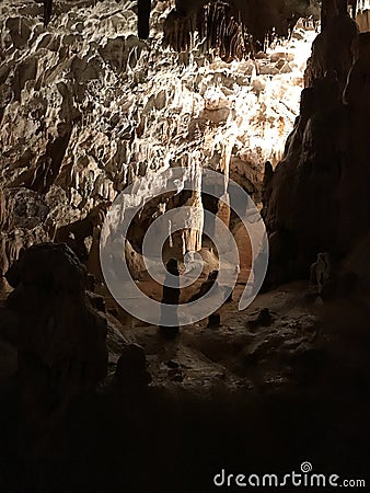 Stalactite and stalagmite of Postojna Cave. Stock Photo