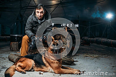 Stalker and dog, friends in post apocalyptic world Stock Photo