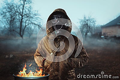 Stalker soldier in gas mask against fire, doomsday Stock Photo
