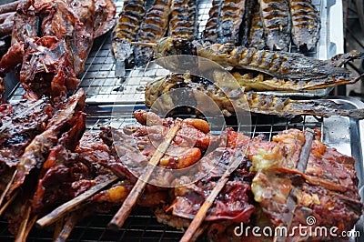 A Stall of grill chickens and fishes Stock Photo