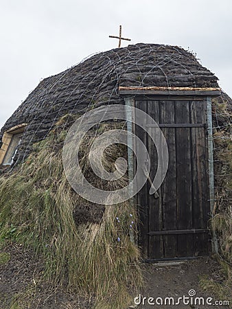 Church at traditonal saami style at Staloluokta sami village at Virihaure lake. Summer moody and foggy day at Editorial Stock Photo