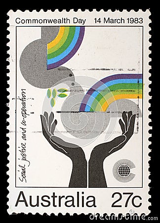 Stamp from Australia shows image celebrating social justice and cooperation, from the Commonwealth Day series Editorial Stock Photo