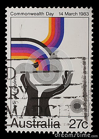 Stamp from Australia shows image celebrating social justice and cooperation, from the Commonwealth Day Editorial Stock Photo