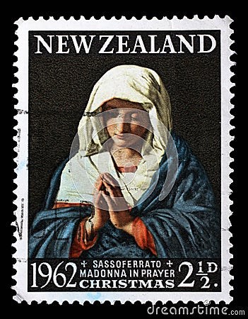 Stamp issued in New Zealand shows praying Madonna, series Christmas Editorial Stock Photo