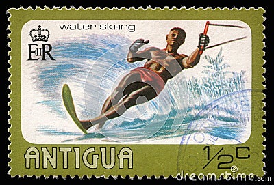 Stamp printed in Antigua shows water skiing Editorial Stock Photo