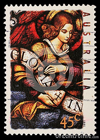 Stamp printed in Australia shows Angel with Gloria in excelsis Deo Banner Editorial Stock Photo