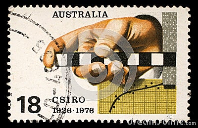 Stamp printed in Australia shows the Survey Rule, Graph, Punched Tape, Commonwealth Scientific and Industrial Research Organizatio Editorial Stock Photo