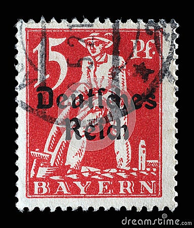 Stamp printed in printed in Bavaria with a `Deutsches Reich` overprint shows Plowman Editorial Stock Photo