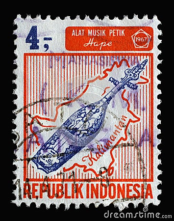 Stamp printed in Indonesia shows Hape musical instrument and Borneo island, Indonesian islands and musical instruments Editorial Stock Photo