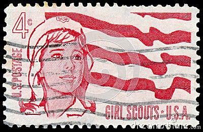 Stamp printed in USA, shows girl scouts and flag Editorial Stock Photo