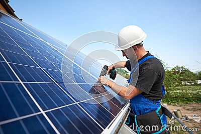 Stand-alone exterior solar panel system installation, renewable green energy generation concept. Stock Photo