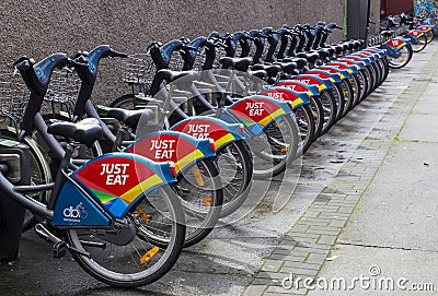 A Stand of Hire Bikes with the Sponsors Logo in Dublin City Cent Editorial Stock Photo