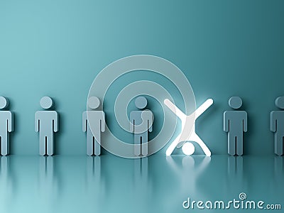 Stand out from the crowd and different creative idea concept One glowing light man standing upside down with arms and legs wide op Stock Photo