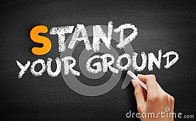 Stand Your Ground text on blackboard Stock Photo