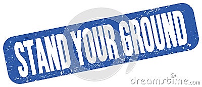 STAND YOUR GROUND text on blue grungy stamp sign Stock Photo