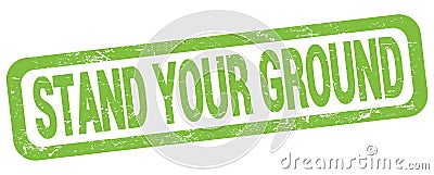 STAND YOUR GROUND text written on green rectangle stamp Stock Photo