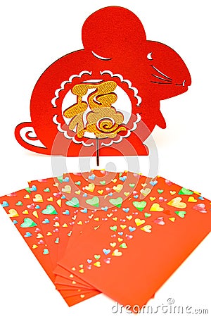 standable fluffy paper cut and red pockets on white as symbol of Chinese New Year of the rat translation of the Chinese character Stock Photo