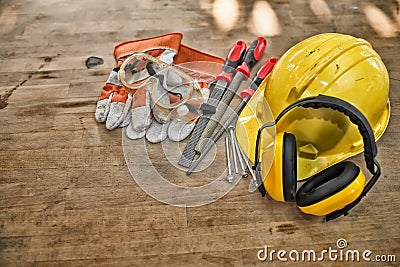 Standard construction safety equipment on wooden table Stock Photo