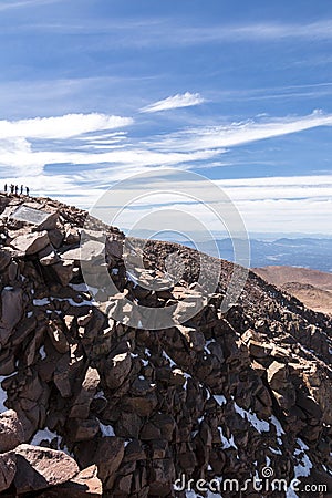 Standing atop Pikes Peak in Colorado. Stock Photo