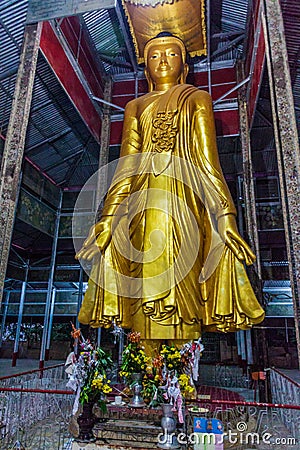 Standing Buddha in Pyi Lone Chamtha pagoda on Mandalay hill, Myanm Stock Photo