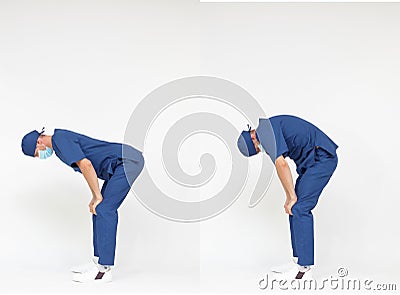 Standing caucasian medical professional in uniform stretching back Stock Photo