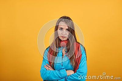 Standing and cross her arms on chest. Young attractive woman with brown hair Stock Photo