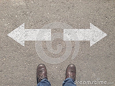 Standing at the crossroad making decision which way to go Stock Photo