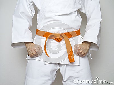 Standing fighter orange belt centered martial arts Stock Photo