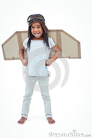 Standing girl with fake wings pretending to be pilot Stock Photo