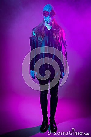 Standing girl with a gas mask on a purple background Stock Photo