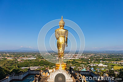 The standing golden Buddha at a hill or valley at Wat phra that khao noi,Nan Thailand. Editorial Stock Photo