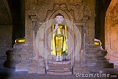 Standing golden Buddha statue in Myanmar Editorial Stock Photo