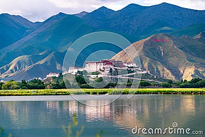 The Potala Palace, the holy place of Tibetan Buddhism by lake Editorial Stock Photo