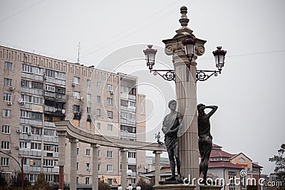 a standing sculpture and a damaged house in the background Editorial Stock Photo