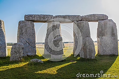 Standing stones of Stonehenge-the worlds most famous prehistoric monument - Closeup from inside the circle with dramatic shadows Stock Photo
