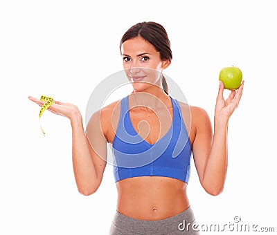 Standing young woman trying weight loss Stock Photo