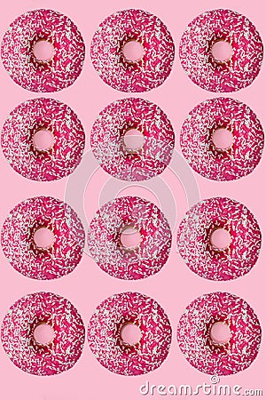 Standout donut. 12 pink donuts. flat lay. pink background Stock Photo