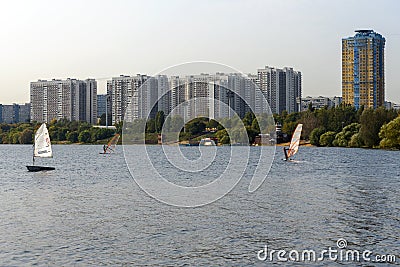 Standup paddleboarding are on the river Moscow, Strogino Editorial Stock Photo