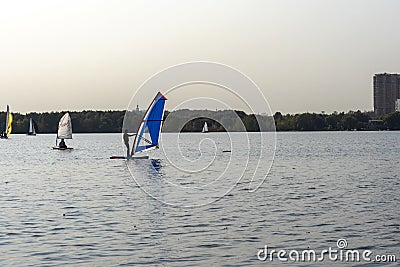 Standup paddleboarding are on the river Moscow, Strogino Editorial Stock Photo