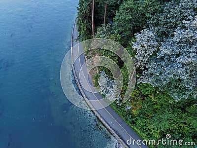 Stanley Park Seawall with Blue Ocean, Vancouver Stock Photo