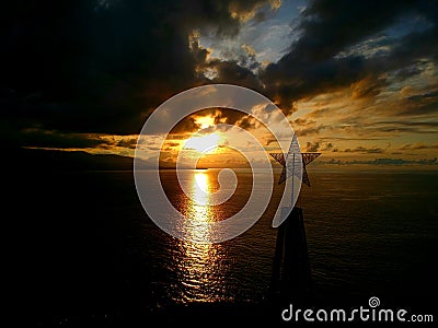 Star cloud sea sunset manado Stock Photo