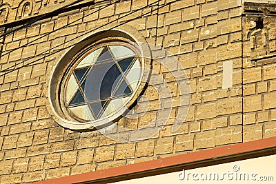 Star of David on a stone wall. Jewish religion Stock Photo