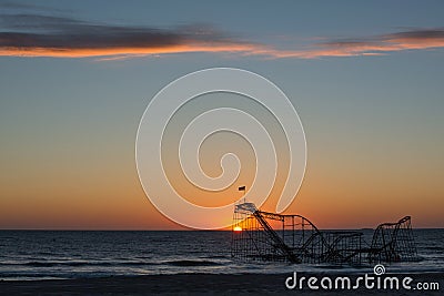 Star Jet Roller Coaster sunrise in the ocean Stock Photo