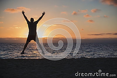 Star Jumps on the Beach Stock Photo